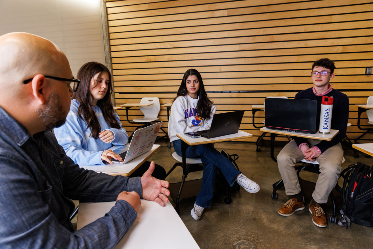 Students sit in semicircle during class discussion