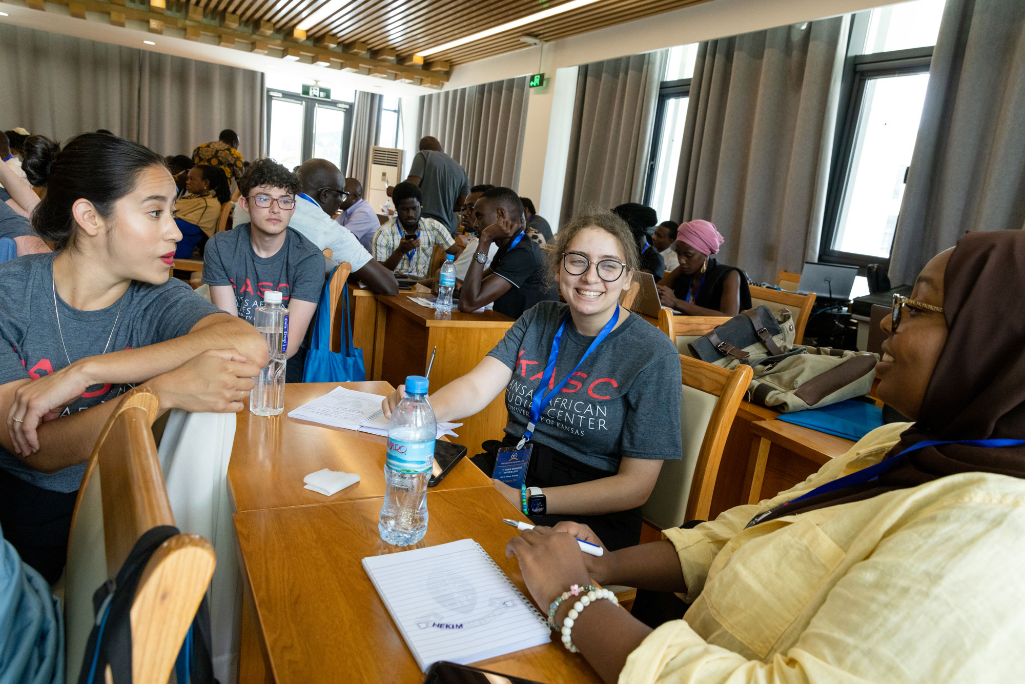 Four students sit at table